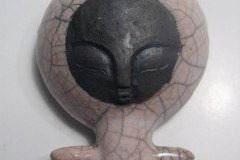 4 hole pendant ocarina made from mold. Stoneware, raku fired.